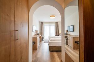Postel nebo postele na pokoji v ubytování Hotel Brunnhofer + 37 fotografií