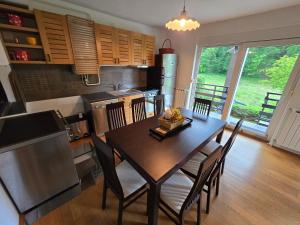 a kitchen and dining room with a table and chairs at Villa Katarina in Krapinske Toplice