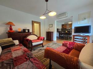 a living room with a couch and a tv at Villa Katarina in Krapinske Toplice