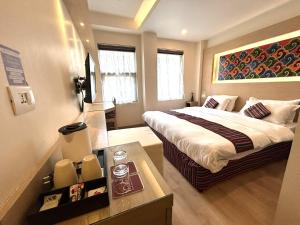 Rúm í herbergi á ViaVia Boutique Hotel - Kathmandu