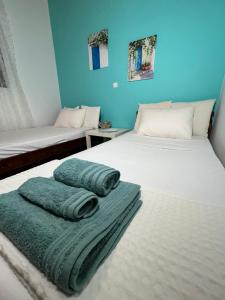 Postel nebo postele na pokoji v ubytování Avra Beach House