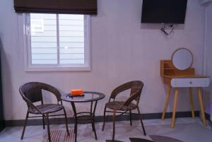 TV a/nebo společenská místnost v ubytování ฟ้ารีสอร์ต FAH Resort