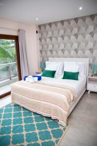 Een bed of bedden in een kamer bij Dos Lunas Aparthotel