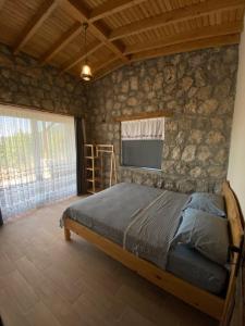Postel nebo postele na pokoji v ubytování Adrasantasev ali baba