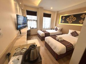 Rúm í herbergi á ViaVia Boutique Hotel - Kathmandu