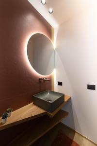 a bathroom with a sink and a mirror at Casa Vacanze Nonna Grazia in Marsala +34 photos