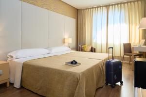 Łóżko lub łóżka w pokoju w obiekcie Hotel Macià Doñana