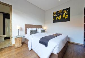 Ein Bett oder Betten in einem Zimmer der Unterkunft Seminyak Villa