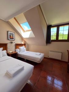 Postel nebo postele na pokoji v ubytování Hotel Pugide