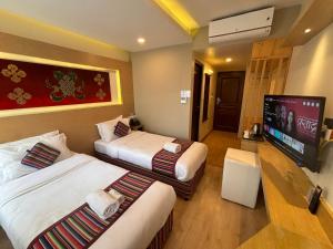 Rúm í herbergi á ViaVia Boutique Hotel - Kathmandu