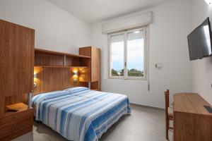 Postel nebo postele na pokoji v ubytování Hotel Flora + 37 fotografií