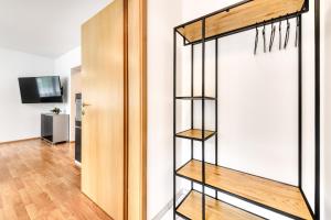 a room with a book shelf next to a door at Studio Iris in Bürserberg