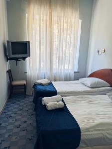 Postel nebo postele na pokoji v ubytování Blue Sevan Hotel