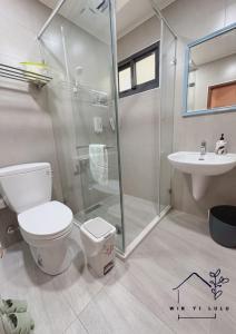 a bathroom with a shower and a toilet and a sink at 溫怡鹿鹿 in Lukang +27 photos