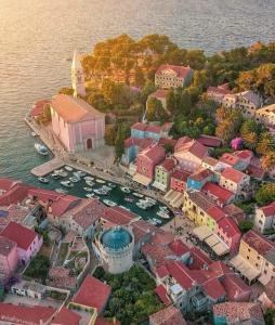 an aerial view of a town with boats in the water at Mansarda in Veli Lošinj