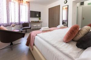 Posteľ alebo postele v izbe v ubytovaní Csillag Villa