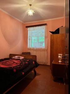 A bed or beds in a room at Vodo's Guesthouse
