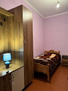 A bed or beds in a room at Vodo's Guesthouse