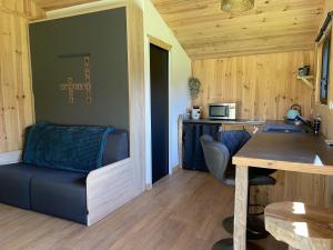 a small room with a table and a chair at Ma cabane Océan in Le Verdon-sur-Mer +2 photos