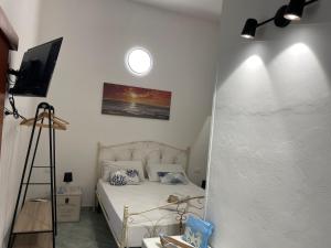 Rúm í herbergi á Luisa Room