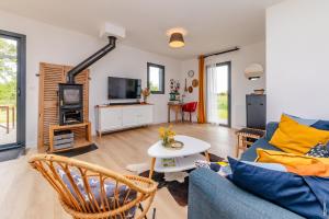 TV a/nebo společenská místnost v ubytování Maison en bois Verte Vigne - Calme - Ecologique