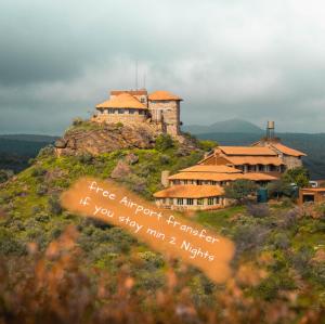 a building on top of a hill with a house at Karivo in Windhoek