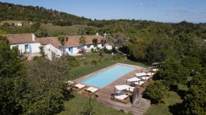 an aerial view of a house with a swimming pool at Herdade da Matinha Country House & Restaurant in Cercal