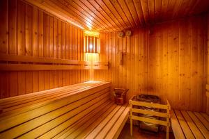 a wooden sauna with a light in the middle at Hotel Villa Siesta in Starý Smokovec