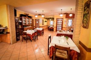 a restaurant with tables and chairs in a room at Agriturismo Marina in Ortona