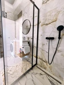 a bathroom with a shower and a sink at Meldaria Residence in Krk