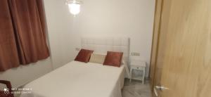 Posteľ alebo postele v izbe v ubytovaní Aparatamento Mirasol Fuengirola.