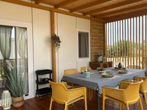 a dining room with a table and chairs at O'LIVE PREMIUM Mobile Home in Drage