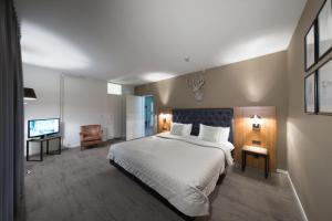 Postel nebo postele na pokoji v ubytování Bilderberg Hotel 't Speulderbos + 32 fotografií
