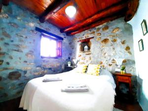 A bed or beds in a room at Petit Nazari