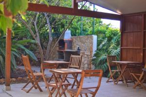 a group of tables and chairs on a patio at Quinta da Norinha in Portimão