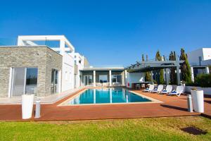 a swimming pool in the backyard of a house at Seafront Villa Layla by Ruidoso Luxury in Ayia Napa