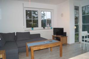 TV a/nebo společenská místnost v ubytování Langer Strandhafer 31