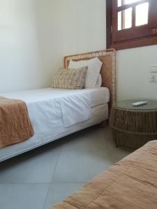 Posteľ alebo postele v izbe v ubytovaní private beachfront house