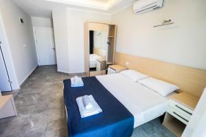Postel nebo postele na pokoji v ubytování M2 Hotel