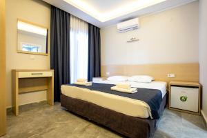 Postel nebo postele na pokoji v ubytování M2 Hotel + 19 fotografií