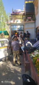 a group of people sitting in a food truck at Odbar Guest House Best Guest House at Leh Ladakh in Leh