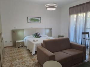 Posteľ alebo postele v izbe v ubytovaní Medoro Camere Milazzo