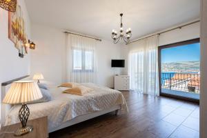 Voodi või voodid majutusasutuse Villa Sunset Apartments toas +51 fotot