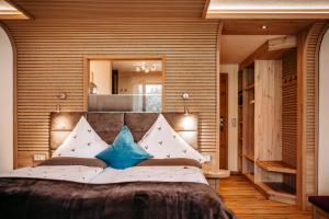 Postel nebo postele na pokoji v ubytování Hotel Leitner