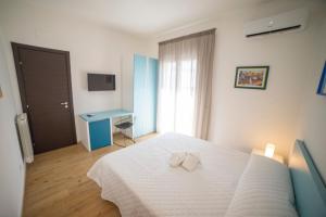 Posteľ alebo postele v izbe v ubytovaní Medoro Camere Milazzo