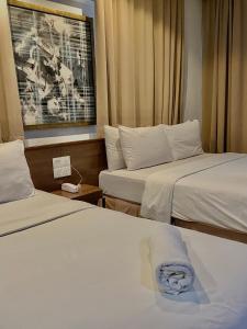 Postel nebo postele na pokoji v ubytování Frenz Hotel Kuala Lumpur