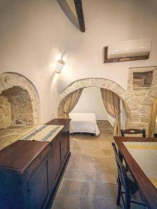 a room with a bedroom with a bed in it at Trullo Originale di Alberobello in Alberobello