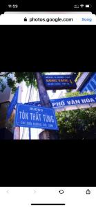 a sign that reads turn that turn on a street at Homestay RV in Nha Trang +3 photos