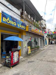a store with an umbrella in front of a street at Homestay RV in Nha Trang