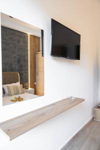 TV a/nebo společenská místnost v ubytování Hotel12